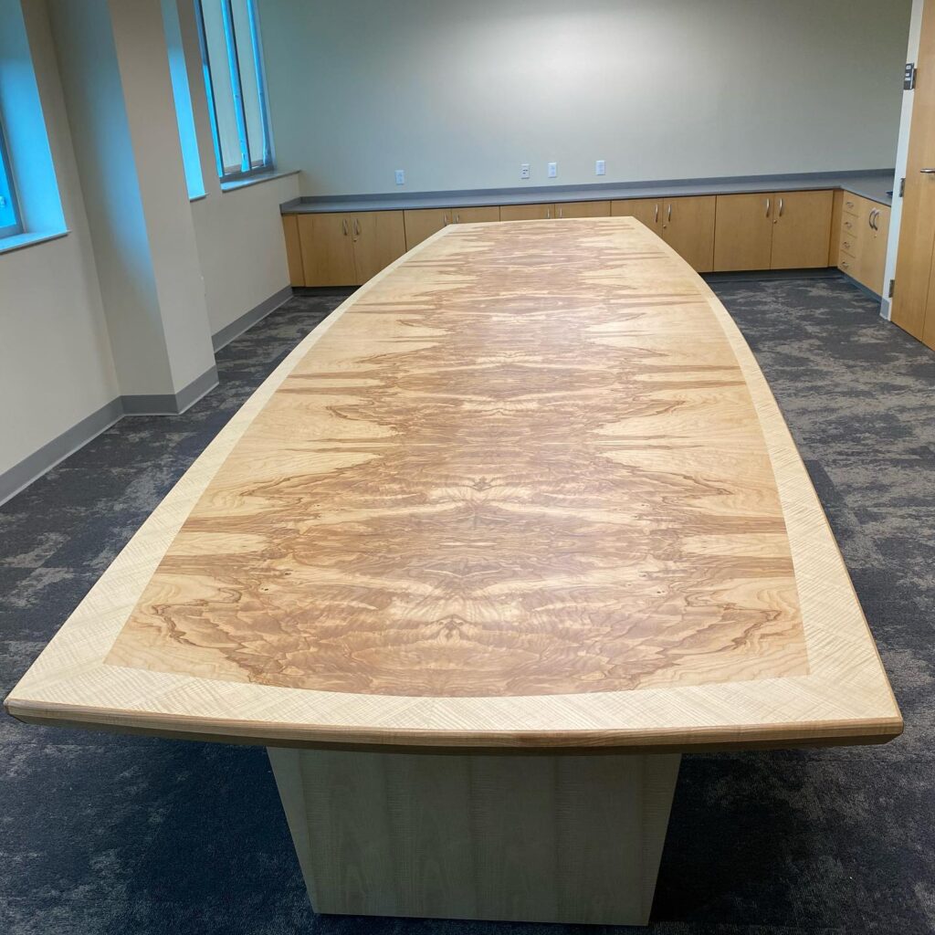 Delivered and installed this 18’ conference table to it’s forever home. Fiddle back ash border, ash burl center. #strawwoodwork #customconferencetable #custommadetables