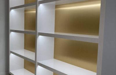 Brass and gloss white cabinet design