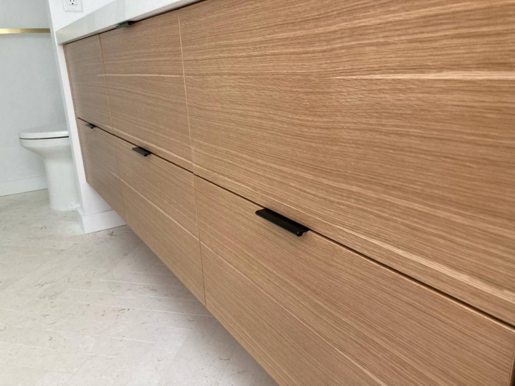 Rift white oak vanity. Grain matched and sequenced. We do all our own veneer work, in-house. There are very few shops that press their own veneer. Thanks @amanda7055 for your impeccable design work, again! #strawwoodwork #riftwhiteoak #interiordesign