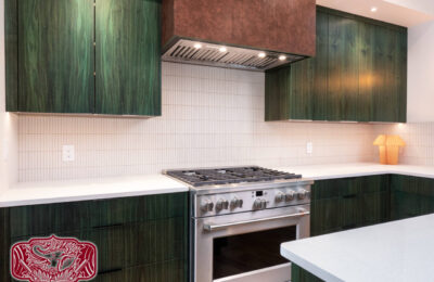 Custom green wood kitchen cabinets